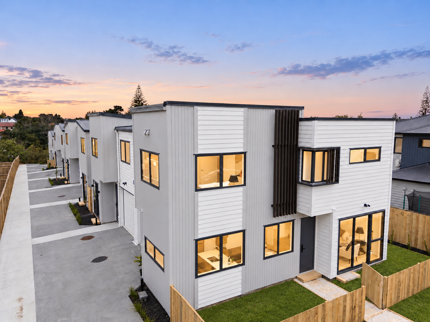 Angled view of the completed street-facing row of homes