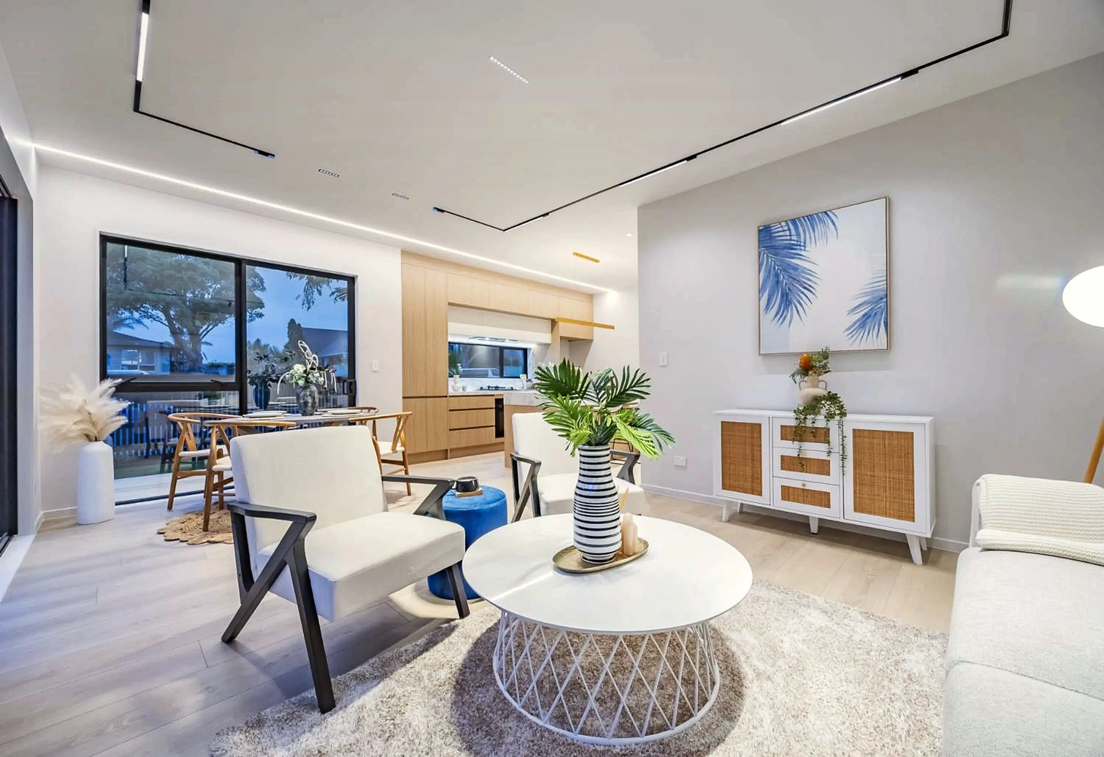 Open-plan living, dining and kitchen space within one of the homes