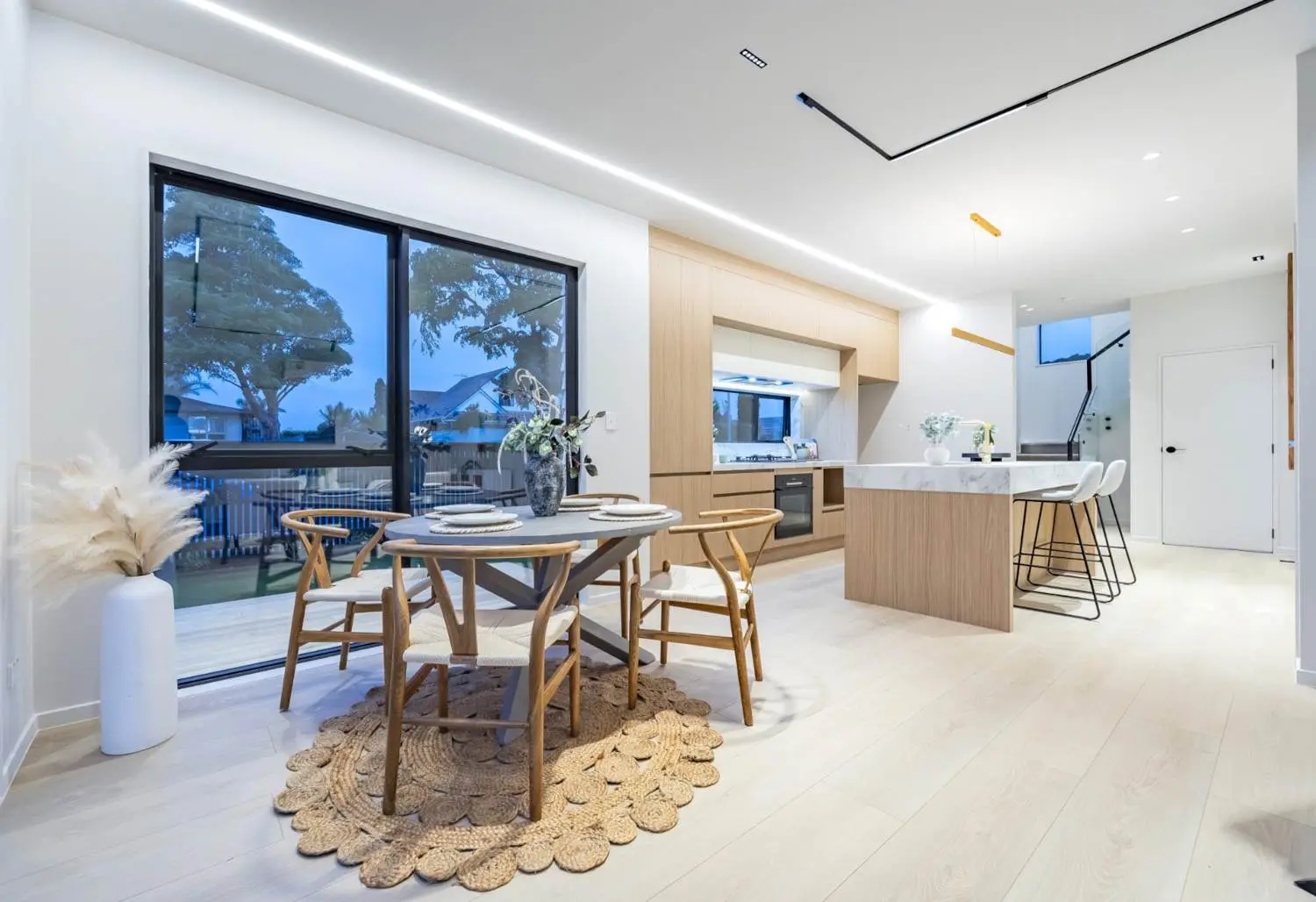 Bright dining space looking toward the kitchen