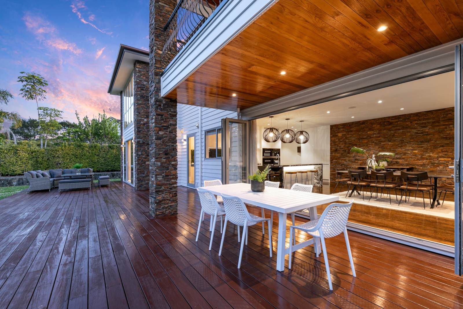 Dining space beneath a warm timber-lined ceiling