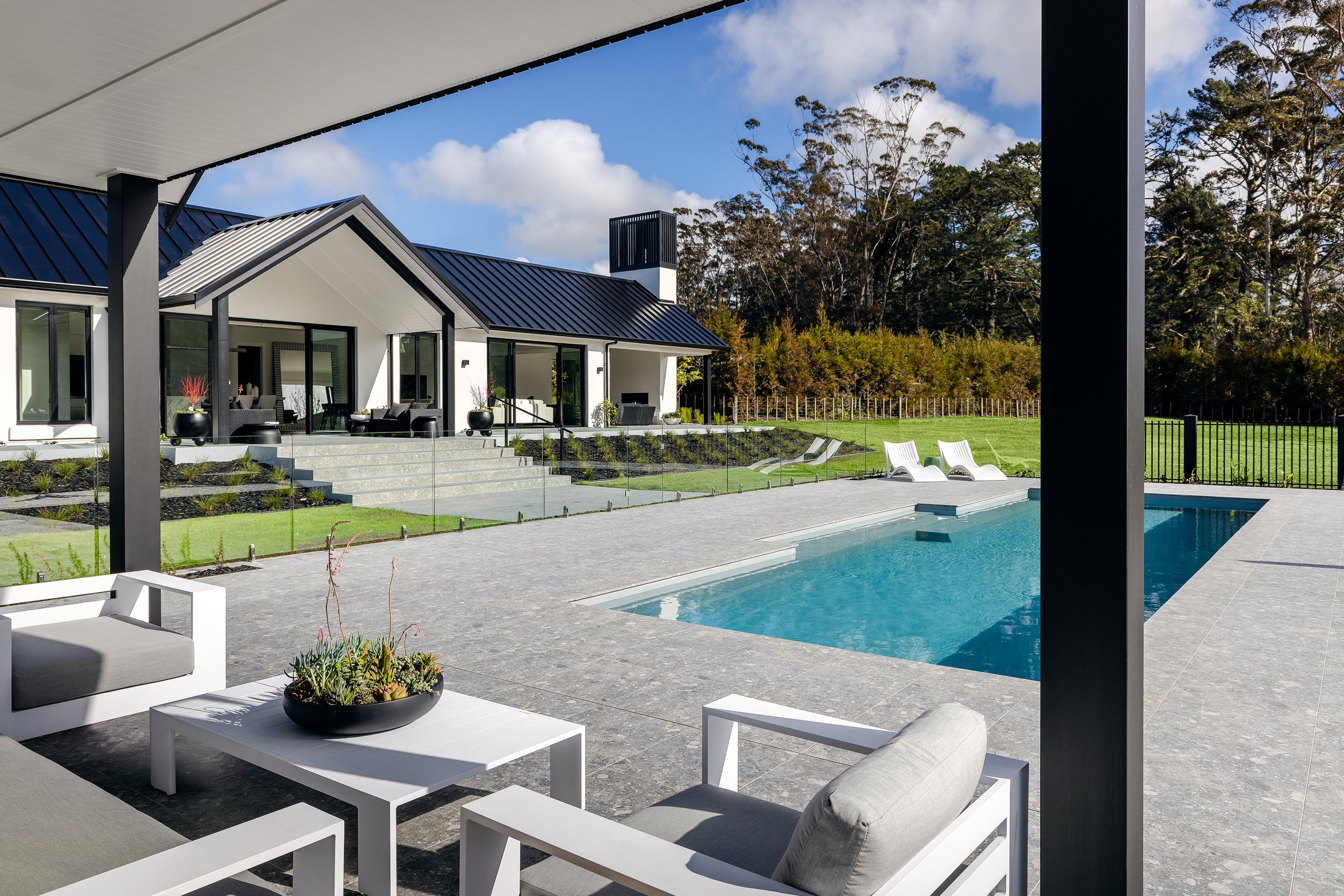 Pool terrace and rear elevation opening to the garden
