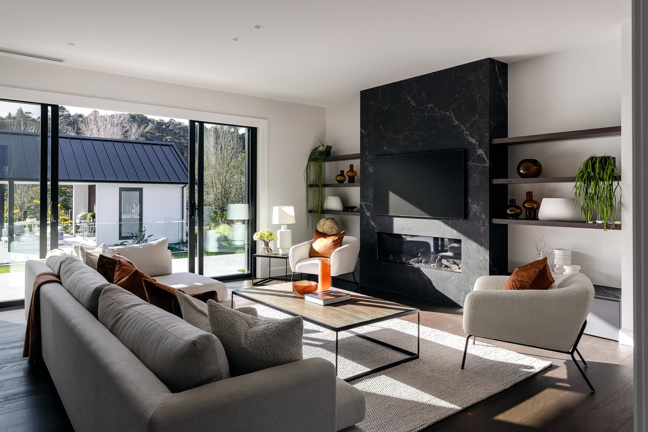 Living room with dark fireplace and garden connection