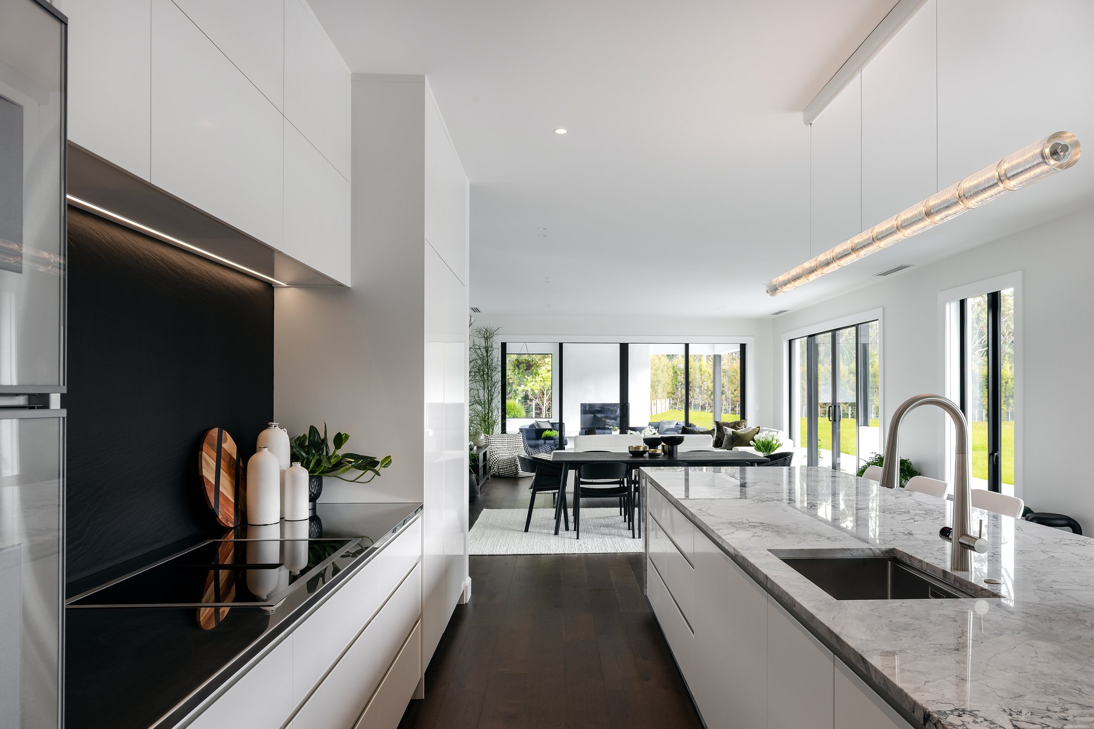 Kitchen and dining aligned with the outdoor spaces