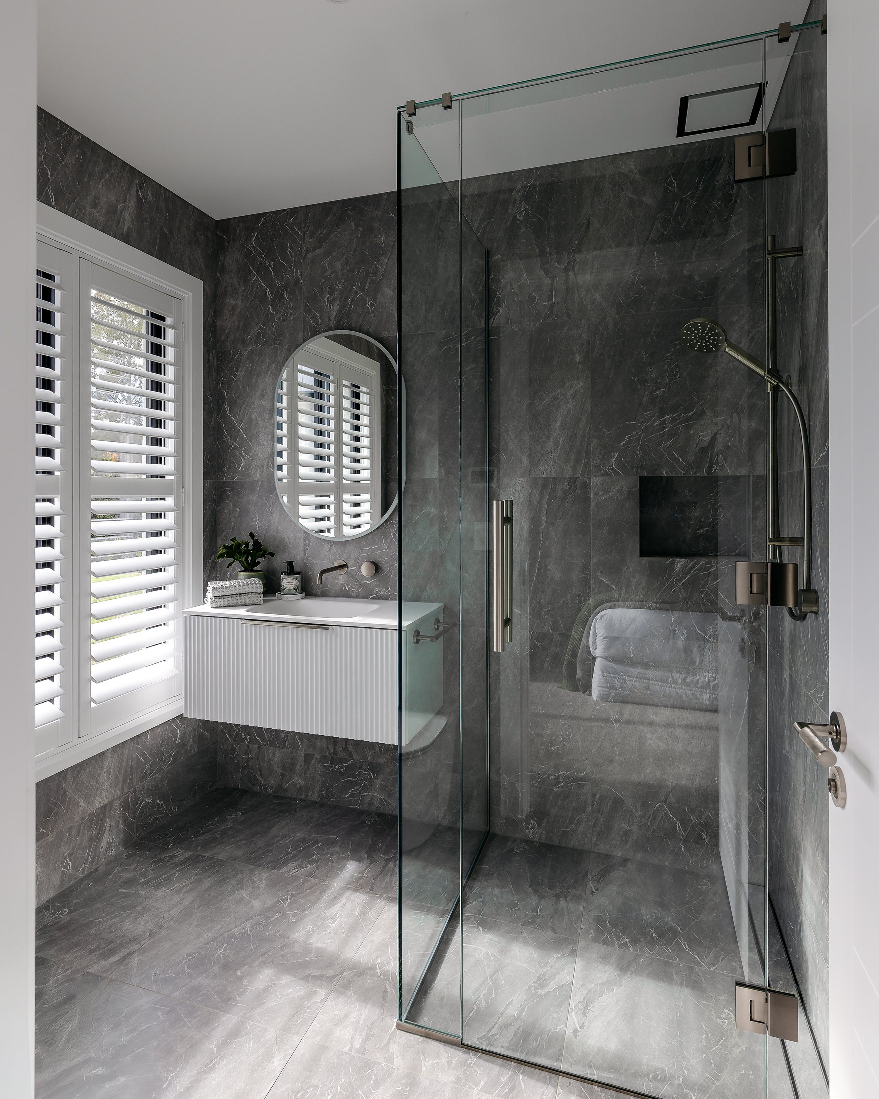 Bathroom and shower with stone surfaces