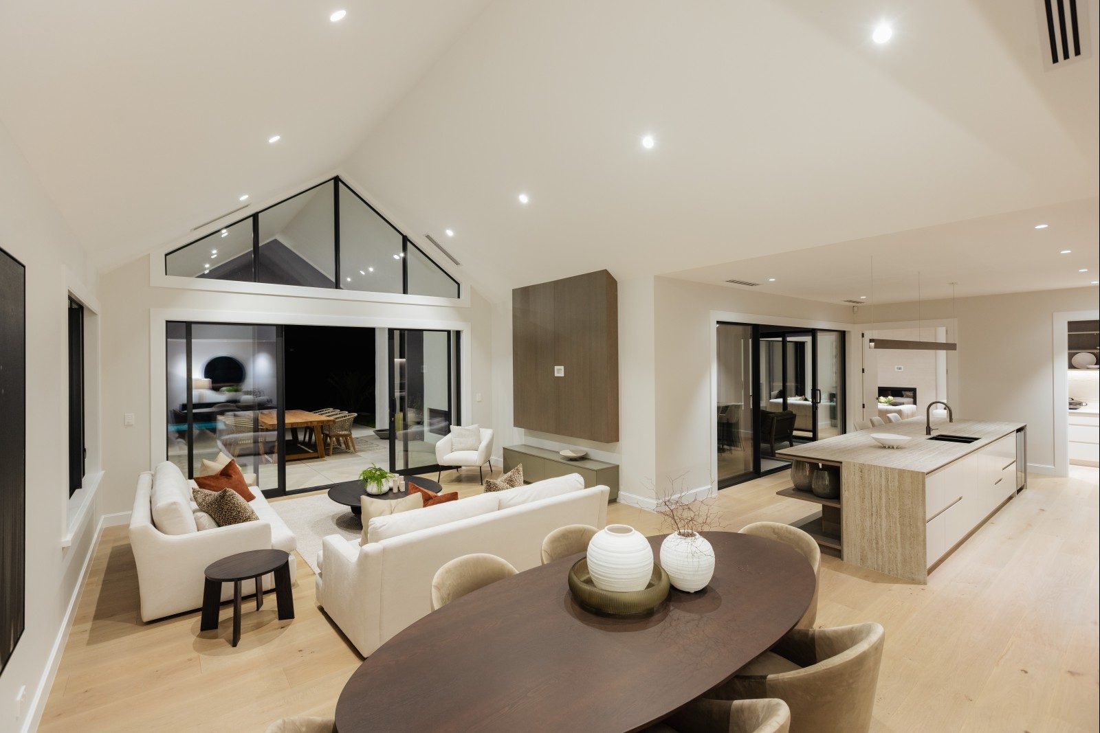 Dining and living areas beneath the gabled ceiling