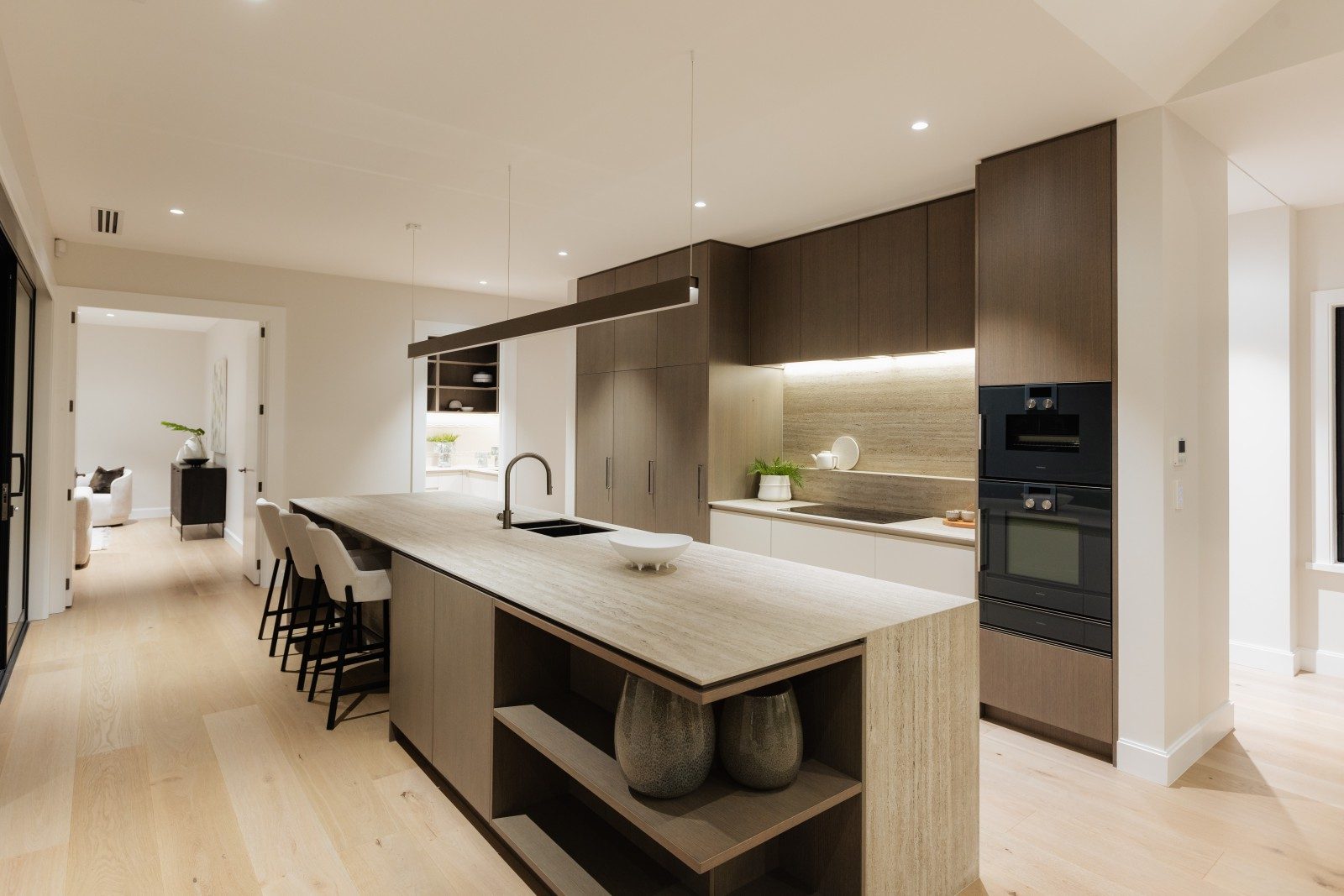 Kitchen island with warm neutral cabinetry