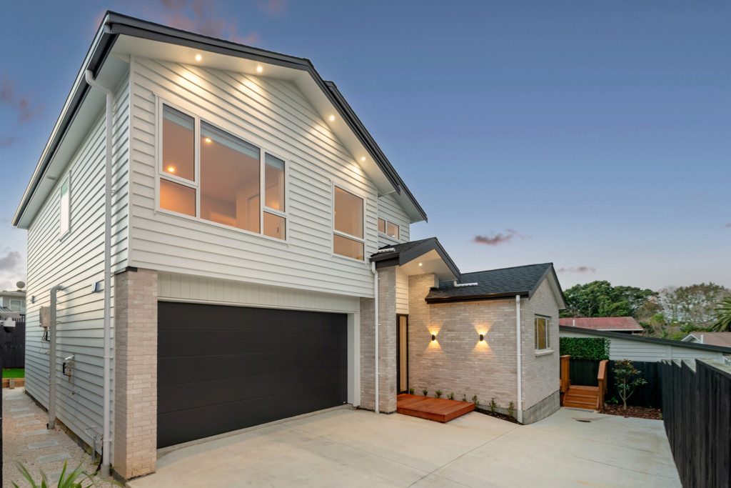 Side elevation with garage and brick entry