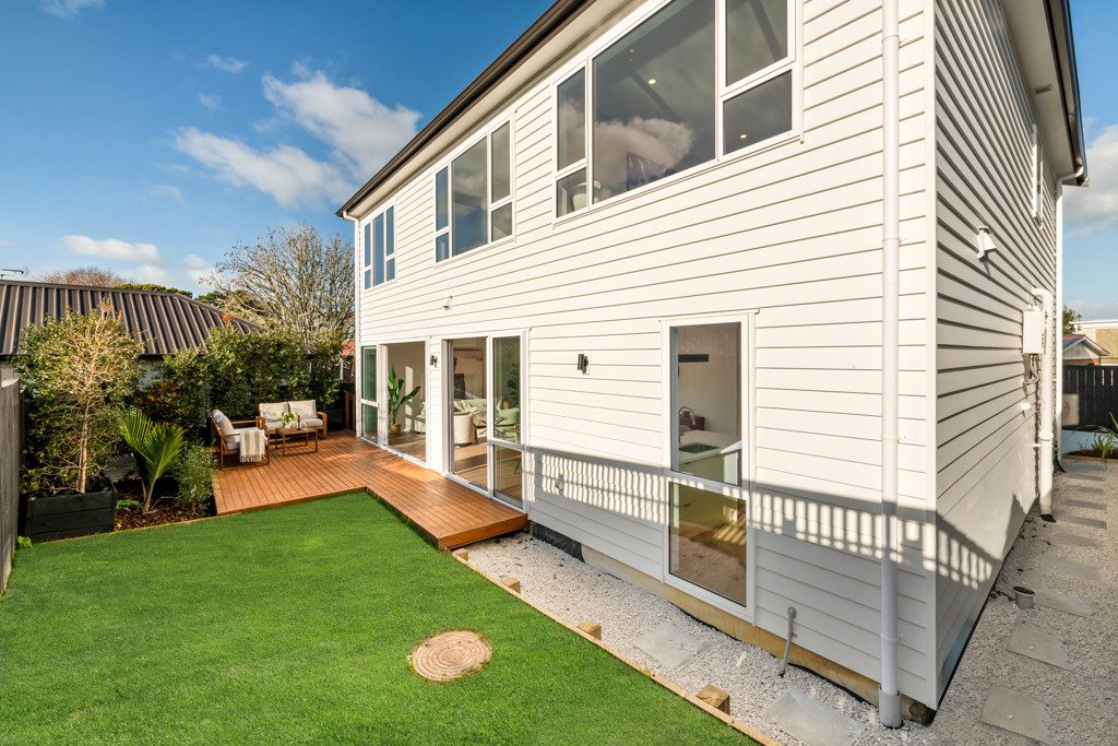 Rear elevation opening to a landscaped garden