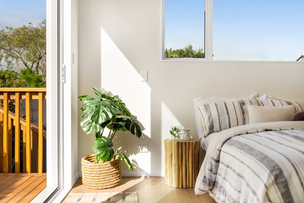 Upper bedroom with access to a small deck