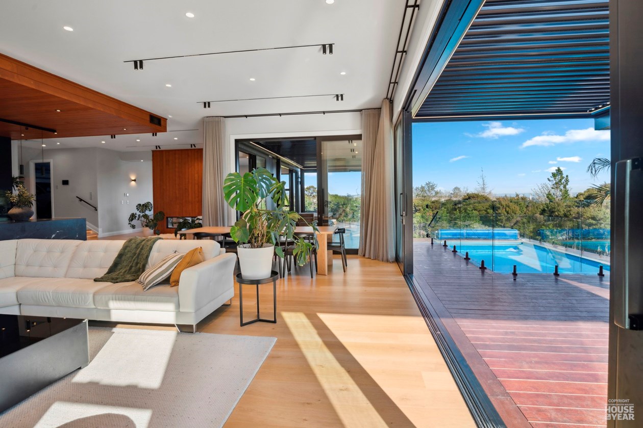 Living room opening directly to the poolside terrace