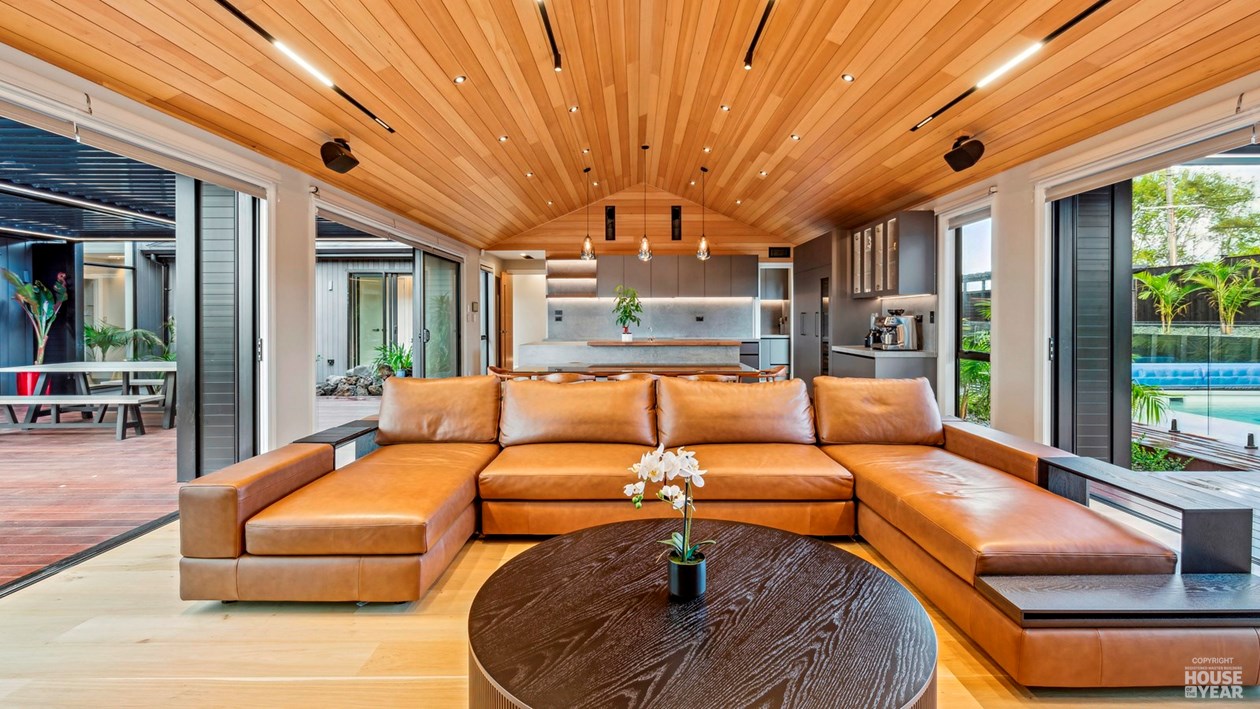 Living room opening to the pool terrace at 44 Kewa Road